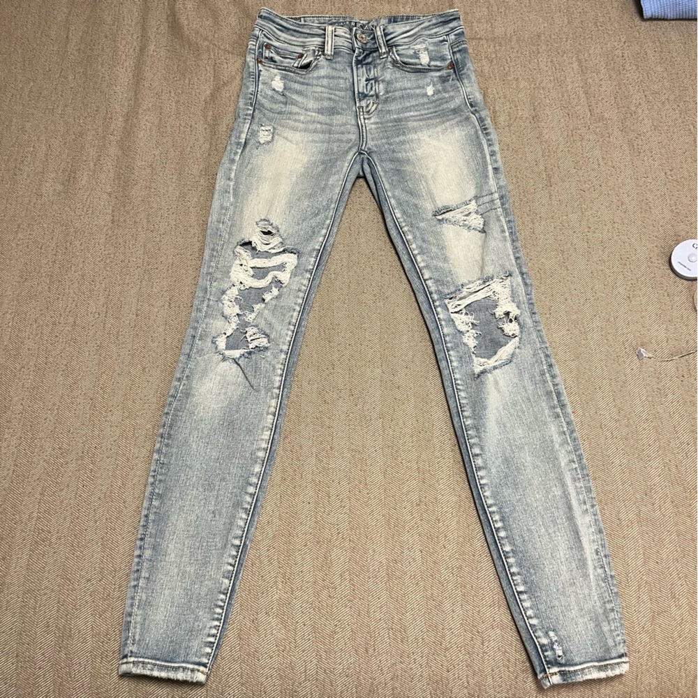 American Eagle Next Level Stretch Hi-Rise Jeggings; Light Wash Distress